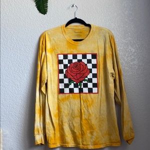 Yellow long sleeve with a graphic design